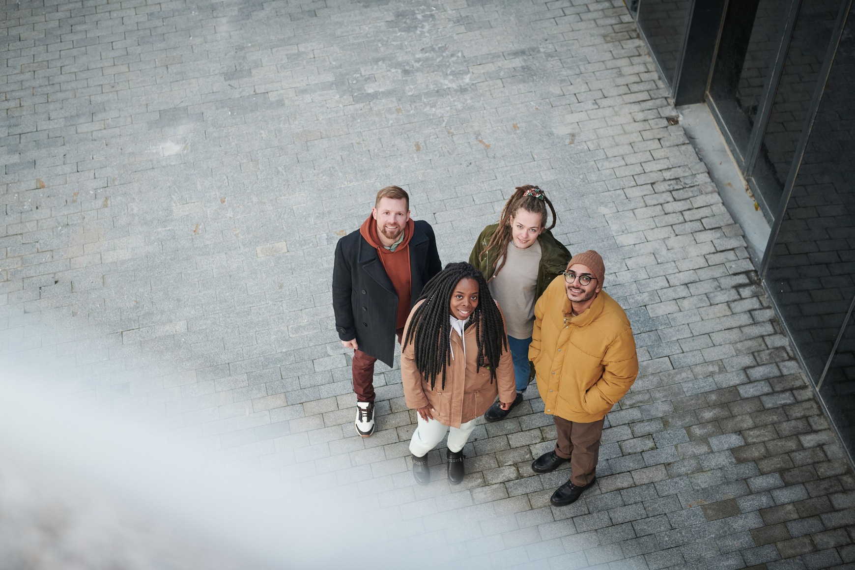 People gathered outside a modern building